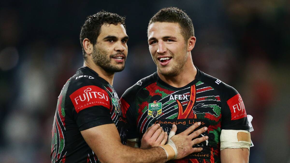 South Sydney players Greg Inglis, left, and and Sam Burgess celebrate victory over the Brisbane Broncos on Thursday night. Picture: GETTY IMAGES

