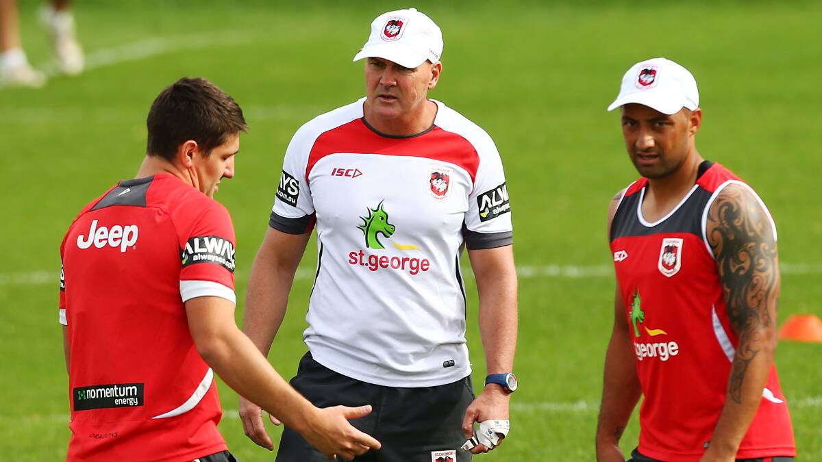 Dragons halves Gareth Widdop, left, and Benji Marshall with coach Paul McGregor at training.