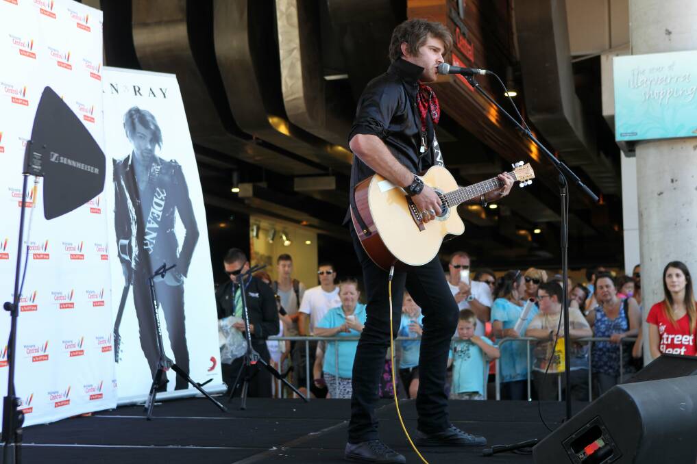 Dean Ray peforms to a crowd at Wollongong Central on Saturday afternoon. Pictures: GREG TOTMAN