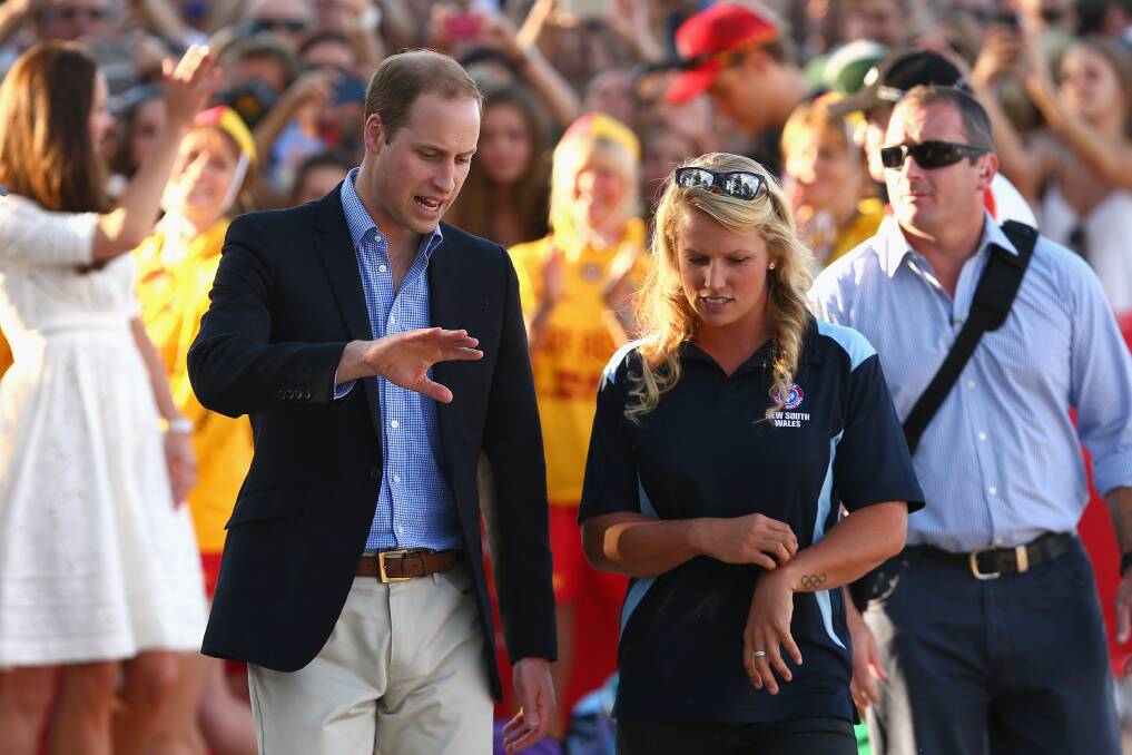 Prince William meets Australian Olympian and surf lifesaver Naomi Flood at Manly Beach. Picture: GETTY IMAGES