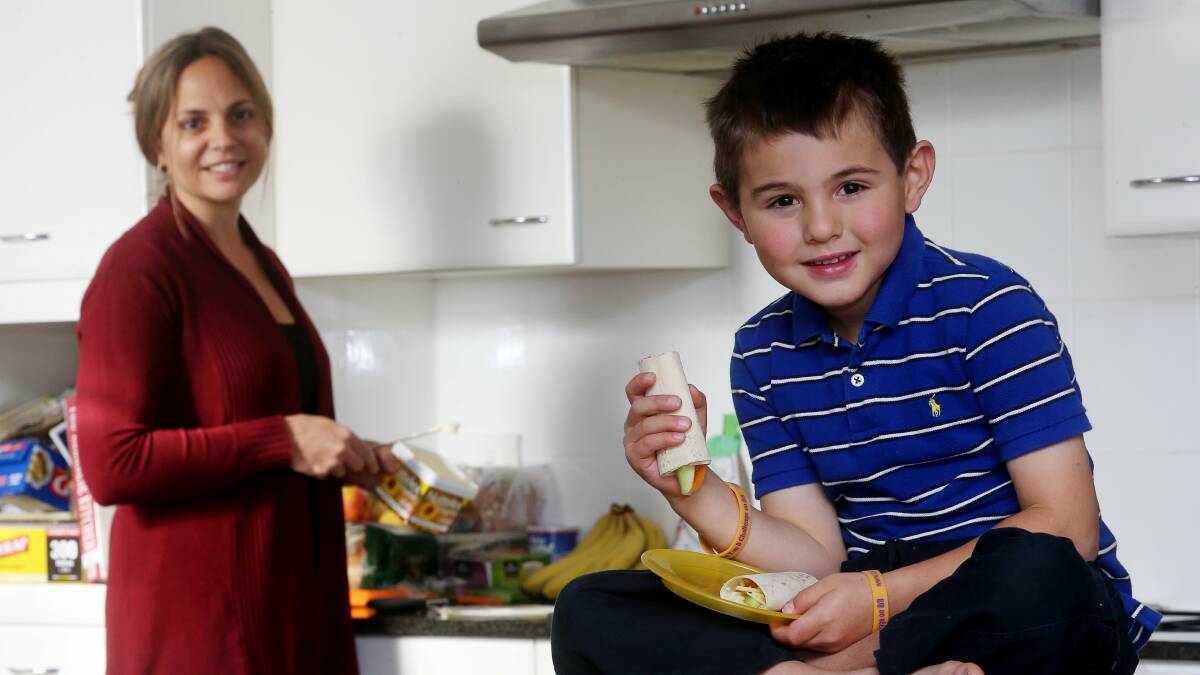 Woonona mother Mercedez Hinchcliff with her son Henry, 6, who suffers from a gastrointestinal disorder. Picture: ROBERT PEET
