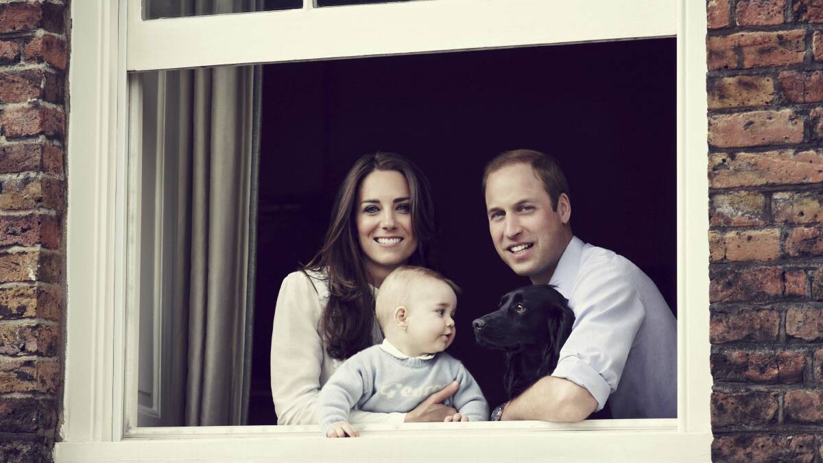 The Duke and Duchess of Cambridge with their son Prince George and dog Lupo at Kensington Palace. Picture: REUTERS