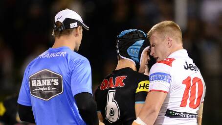 Jamie Soward of the Panthers and Mike Cooper of the Dragons scuffle during the round 14 match at Sportingbet Stadium. Picture: GETTY IMAGES