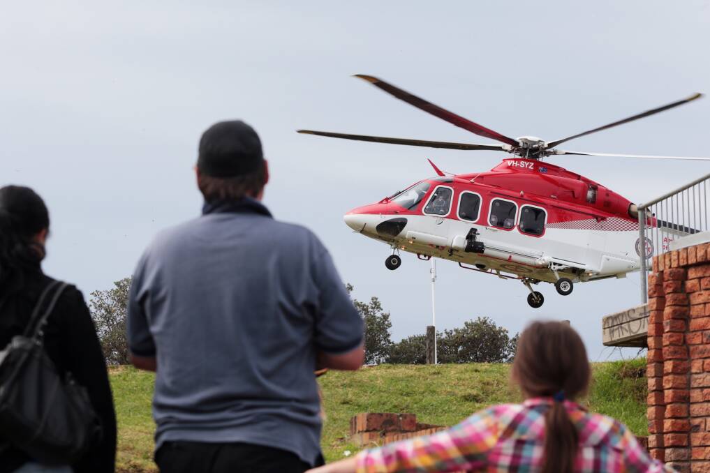 A woman is transported to hospital by ambulance helicopter at Bald Hill in Stanwell Park. Picture: ADAM McLEAN