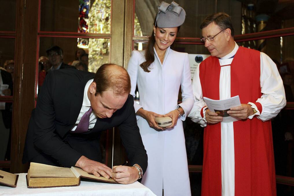 Prince William signs the First Fleet Bible and Prayer Book. Picture: REUTERS