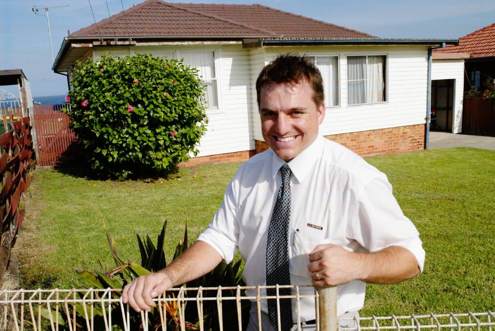 Real estate agent Adam McGrath at a Barrack Point home purchased for $64,000 in the 1980s. It could prove a nice little earner if it fetches the $1.54 million asking price.