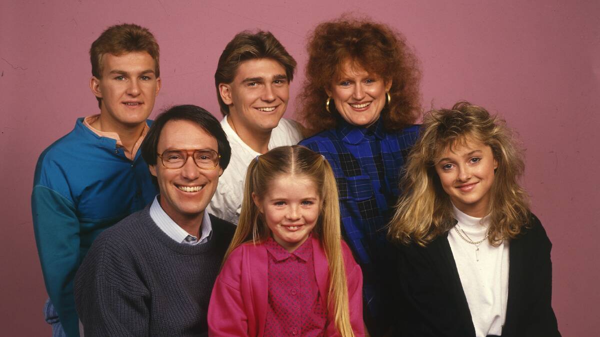 Sarah Monahan seen here as a child star with the cast from Hey Dad!. She's on Robert Hughes' right. Photo: Supplied