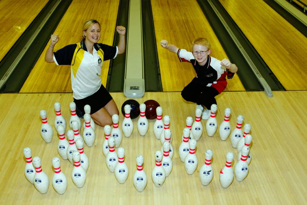 Albion Park’s Rowan Chapman with team-mate Rhiannon John. Chapman is believed to be the youngest person in Australia to achieve a perfect game in tenpin bowling.