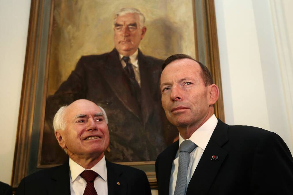 Former Prime Minister John Howard with Prime Minister Tony Abbott. Picture: ALEX ELLINGHAUSEN