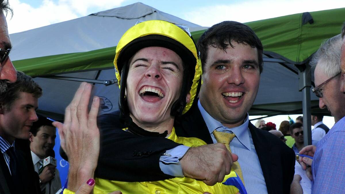 Jockey Jason Collett and trainer Sam Kavanagh celebrate winning the Canberra Guineas.