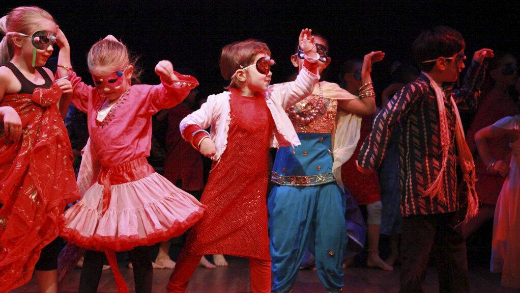 Children at an Australian Theatre for Young People creativity camp rehearse their performance. 
