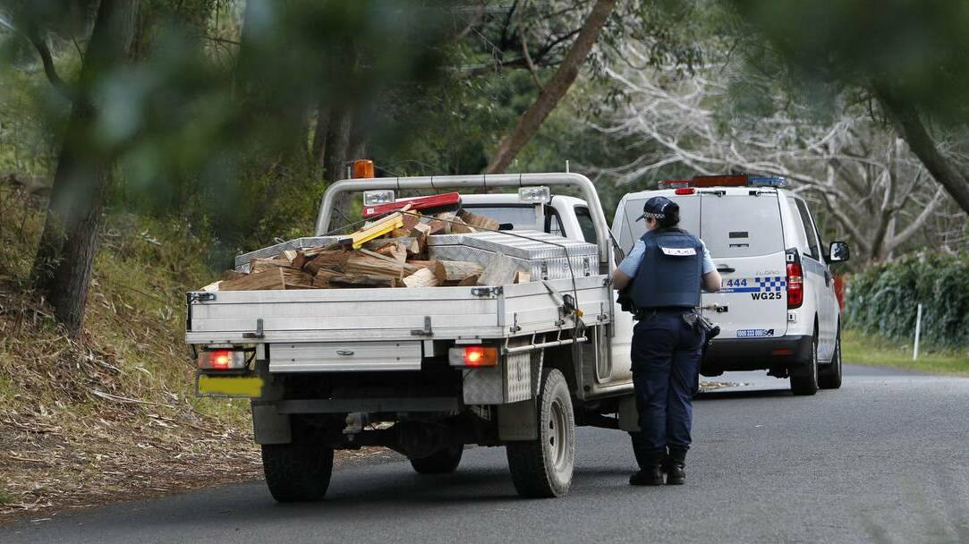 Police restrict access to Morrison Avenue, Wombarra, during a two-hour siege on a nearby property.