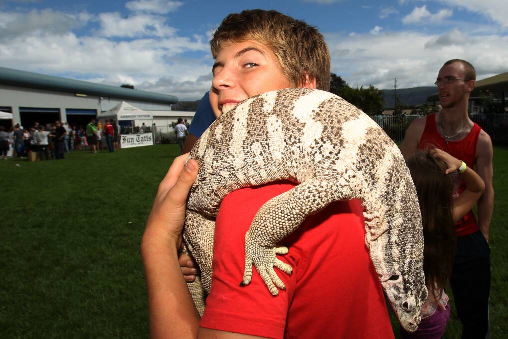 Callum, 14, with Rambo, a five-year-old Spencer's Monitor at the Illawarra Reptile Show. Picture: GREG TOTMAN