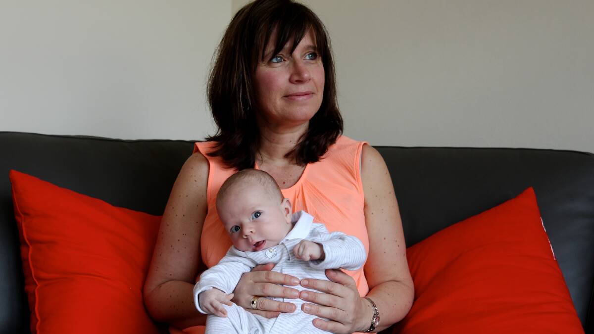 Much debate over the procedure: Stefanie MacDonald with her circumcised son, James. Picture: Janie Barrett