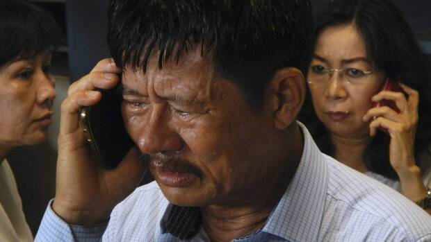 Anxious relatives arrive at airport after flight with 162 onboard goes missing. Picture: REUTERS