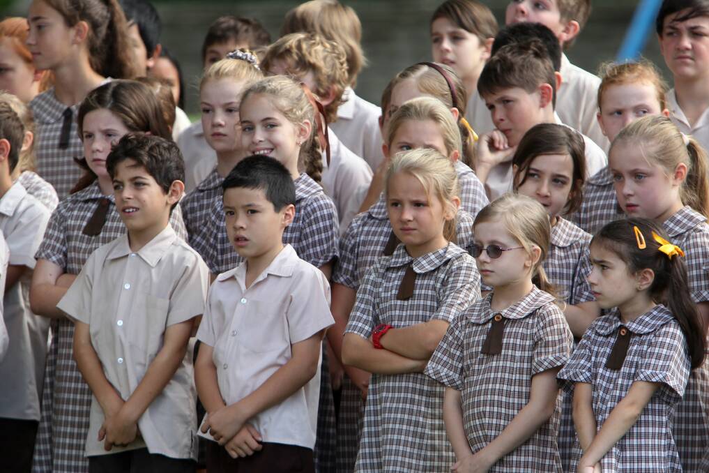 Students attend an Anzac Day ceremony in MacCabe Park. Picture: GREG TOTMAN