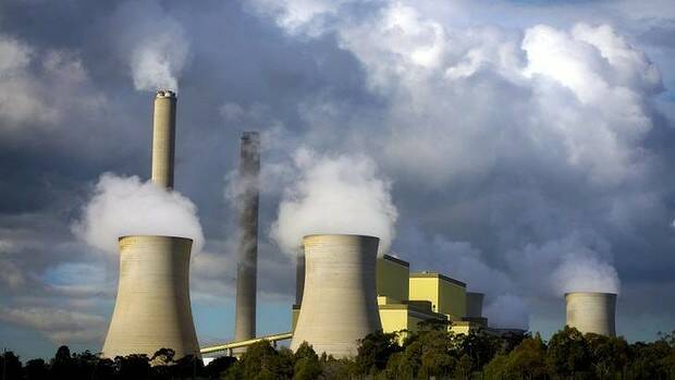 Steam towers at a power station. Emissions are falling in the power sector - for now.