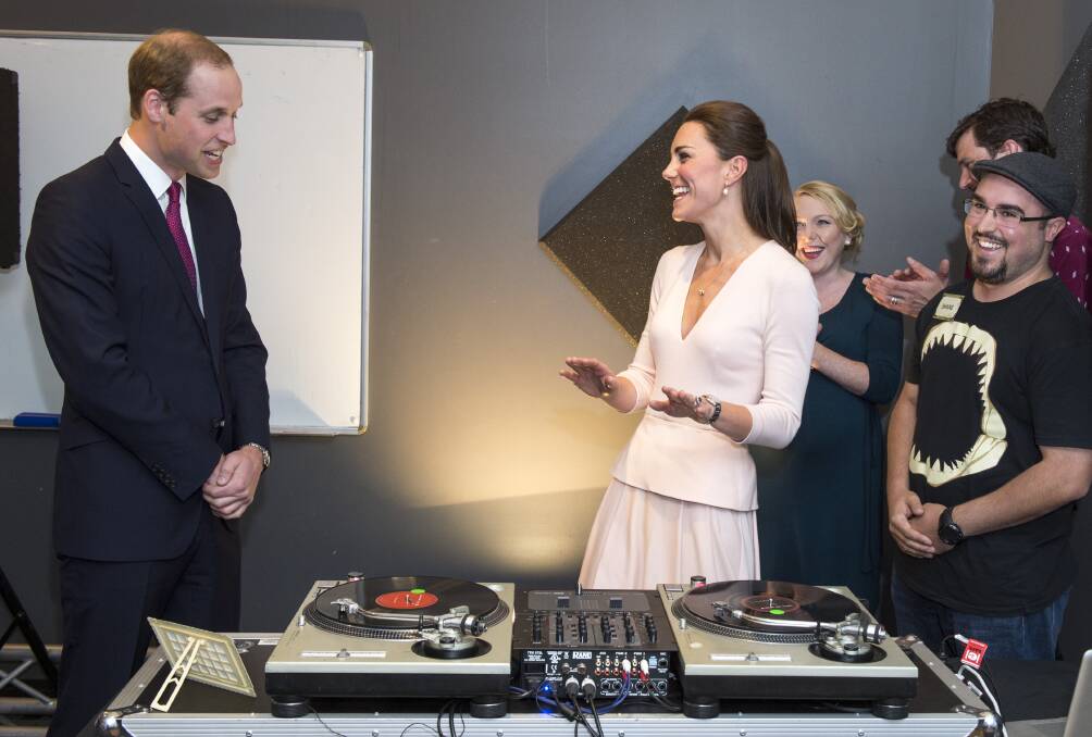 William and Catherine laugh as they are shown how to play on DJ decks at youth community centre Northern Sound System in Elizabeth, Adelaide. Picture: GETTY IAMGES