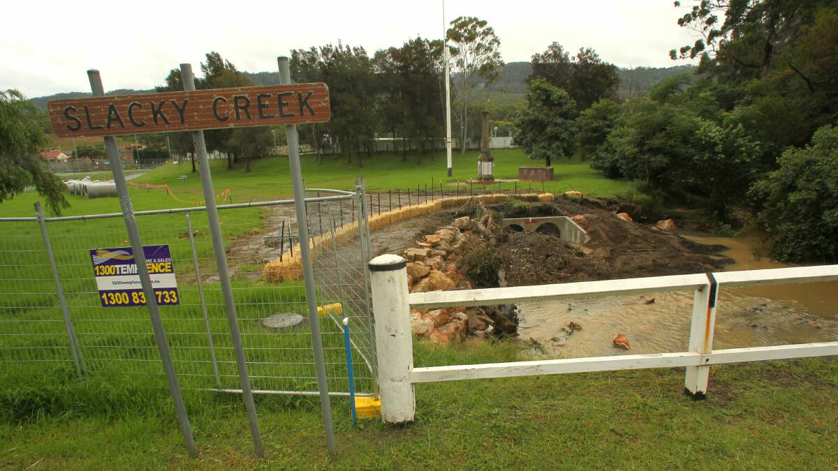 Slacky Creek at Bulli has been fenced off so stormwater drainpipes can be laid.