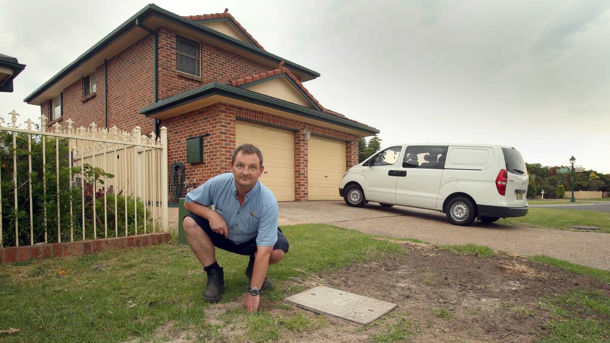 Shawn Moore points to the spot where he claims that NBN contractors drilled through a stormwater pipe. Picture: KIRK GILMOUR