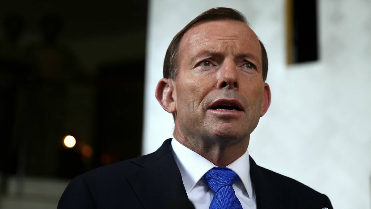 Prime Minister Tony Abbott addresses the media in Port Moresby on Sunday. Photo: Alex Ellinghausen