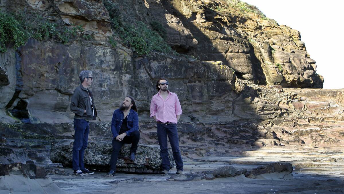 Three of the band members pictured on City beach.