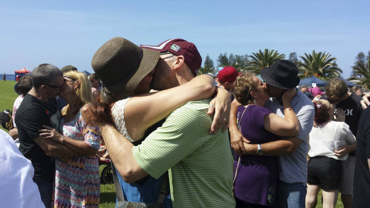 Kiama Autumn Festival-goers locked lips to break the world record for most couples kissing simultaneously for 60-seconds. . Picture: GEMMA KHAICY