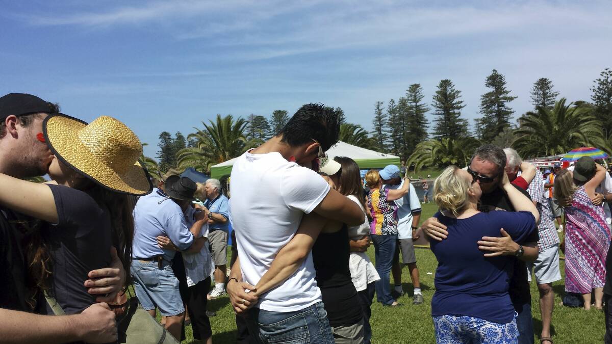 Kiama Autumn Festival-goers locked lips to break the world record for most couples kissing simultaneously for 60-seconds. . Picture: GEMMA KHAICY