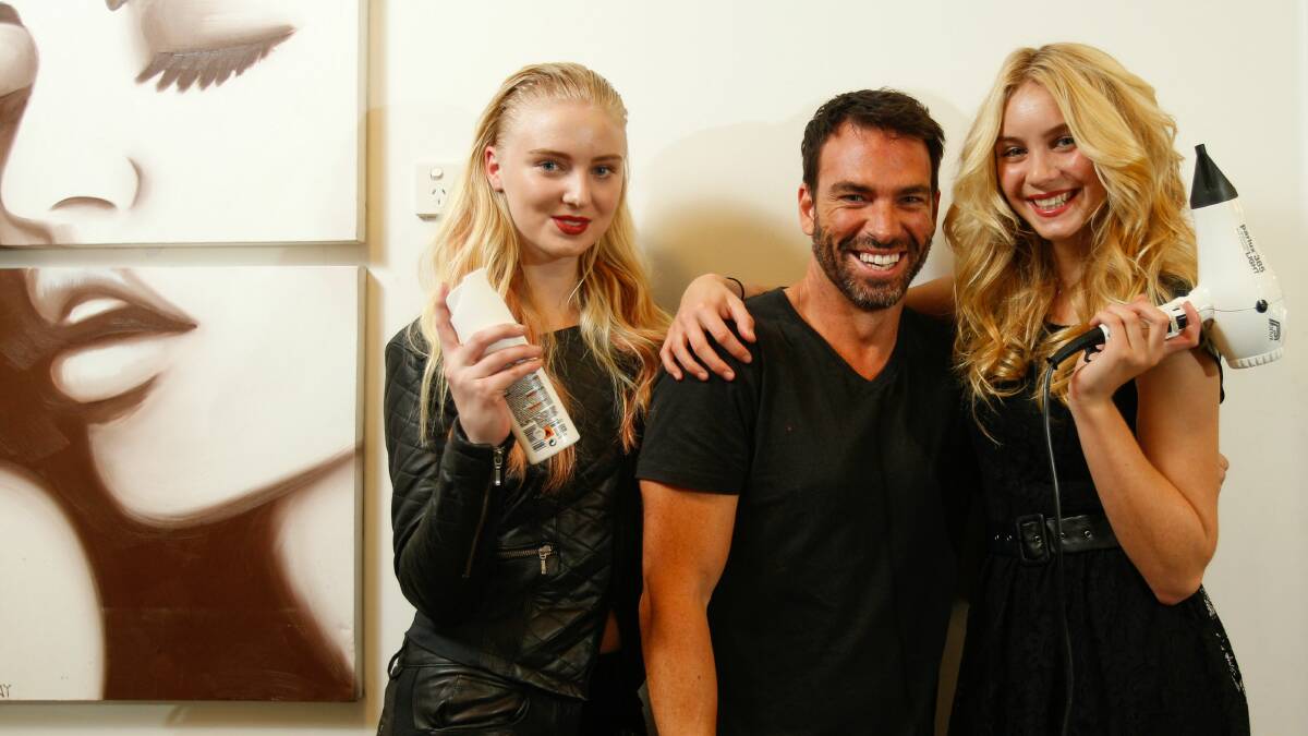 Hairdresser Peter Thomsen with models Enya Smith, left, and Summer Allen working on the popular hairstyles and colours for 2014. Picture: CHRISTOPHER CHAN