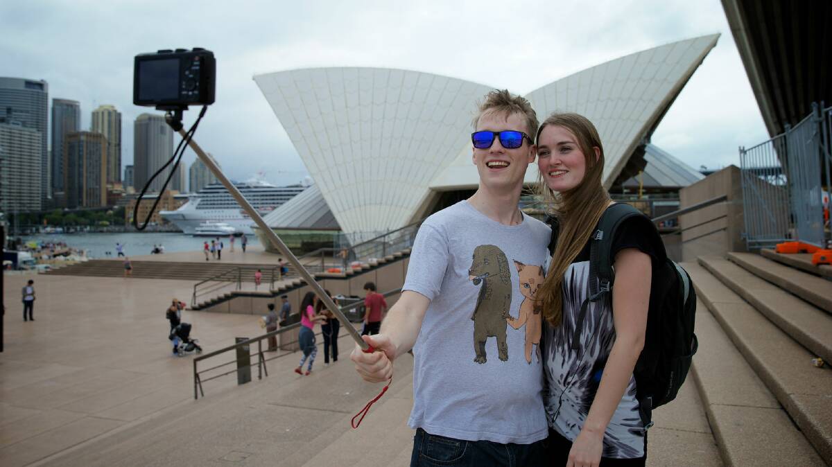 Alex Kyling and Linda Keizer use a selfie stick at the Opera House. Picture: WOLTER PEETERS