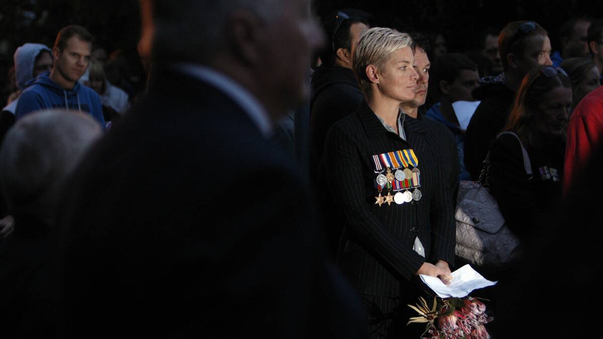 Lynette Robb travelled from Batemans Bay to pay tribute to her father, grandfather and great-grandfather at the Port Kembla dawn service. Picture: ANDY ZAKELI