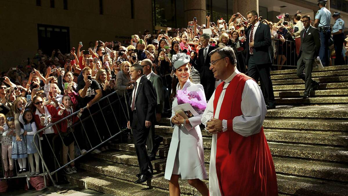The Duchess of Cambridge walks with the Archbishop of Sydney following an Easter Sunday service at St Andrews Cathedral. Picture: AP