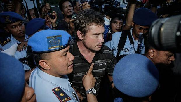Australian Matt Christopher Lockley is arrested by Indonesian military officers. Picture: GETTY IMAGES