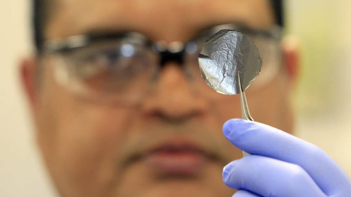 UOW Innovation Campus Senior Research Fellow Dr Sanjeev Gambhir holds up a sheet of graphene created from carbon at the campus. Picture: ANDY ZAKELI