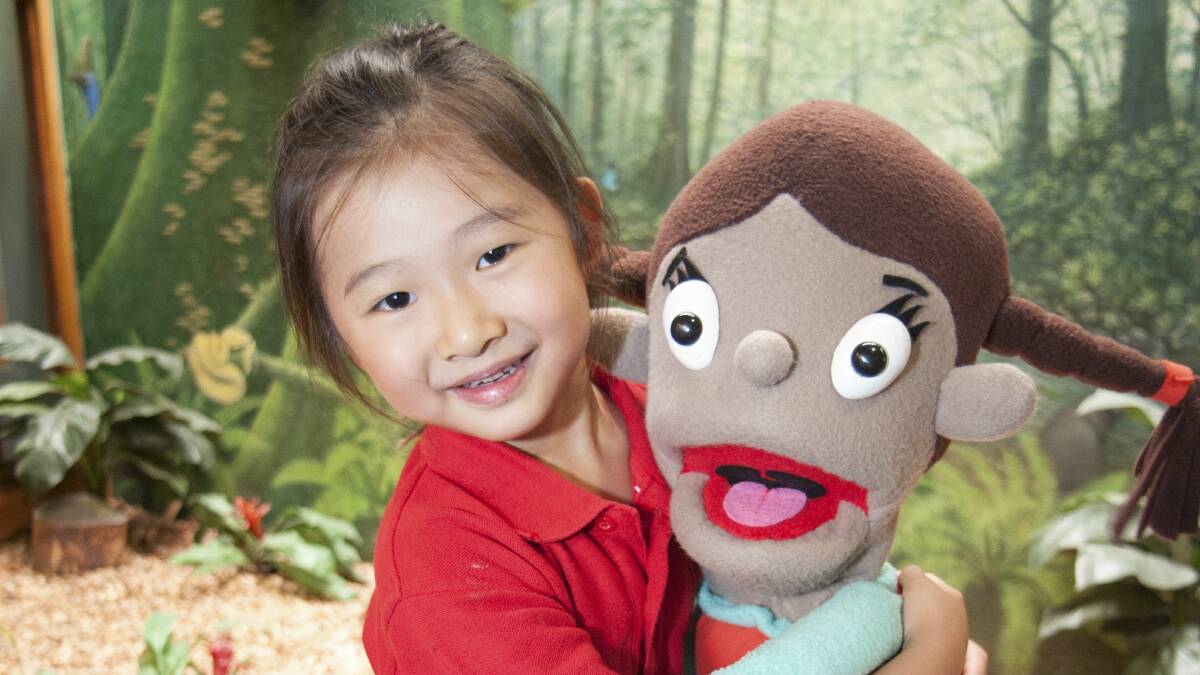 Destiny Tsai enjoys the Camp Quality puppet show.