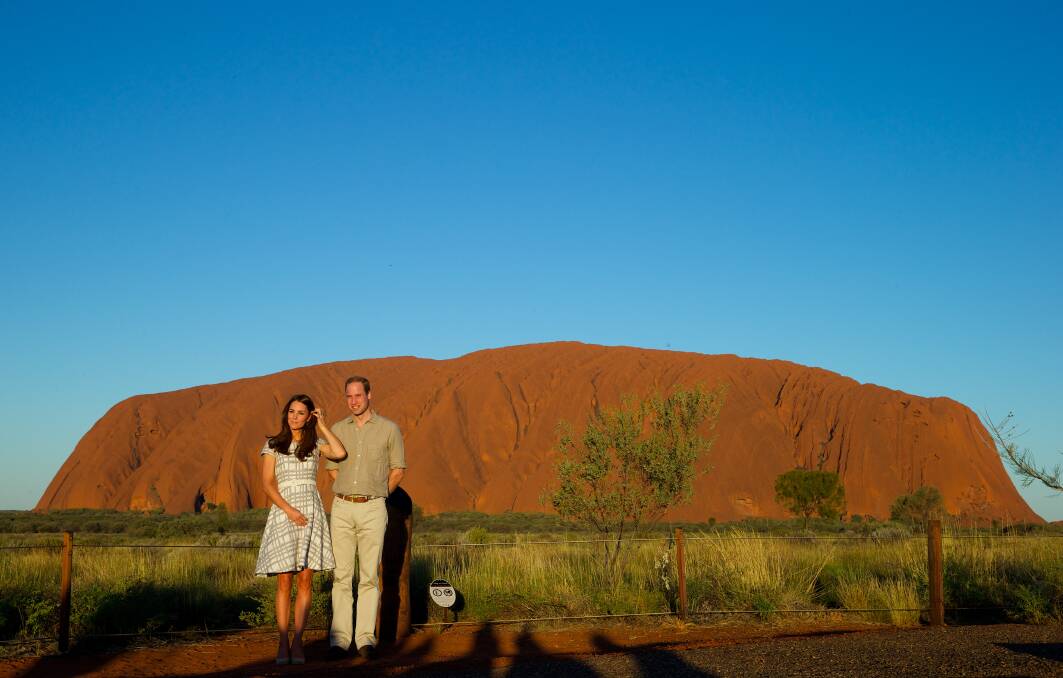 The royal couple during a sunset walk at Uluru. Picture: WOLTER PEETERS
