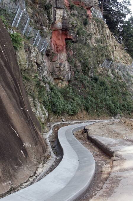 Works on Mt Keira Road in June after its closure last year due to land slippage. 