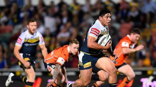 Outclassed: Jason Taumalolo outpaces Wests Tigers players en route to a try for the Cowboys. Picture: GETTY IMAGES
