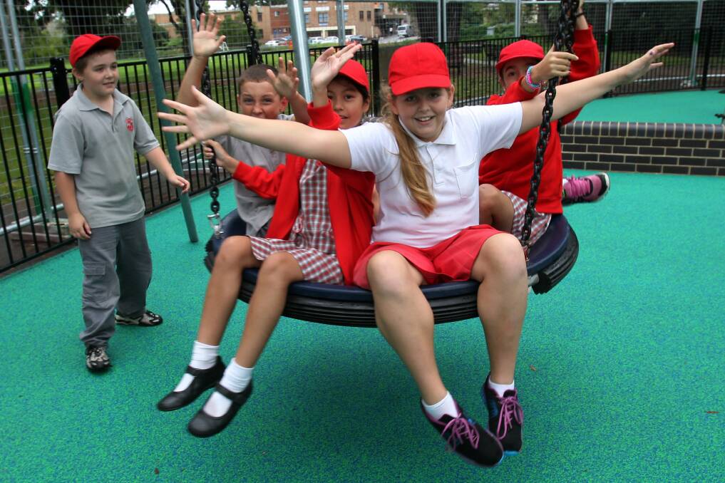Children from Corrimal Public School get in the swing of things at Luke's Place. Picture: GREG TOTMAN