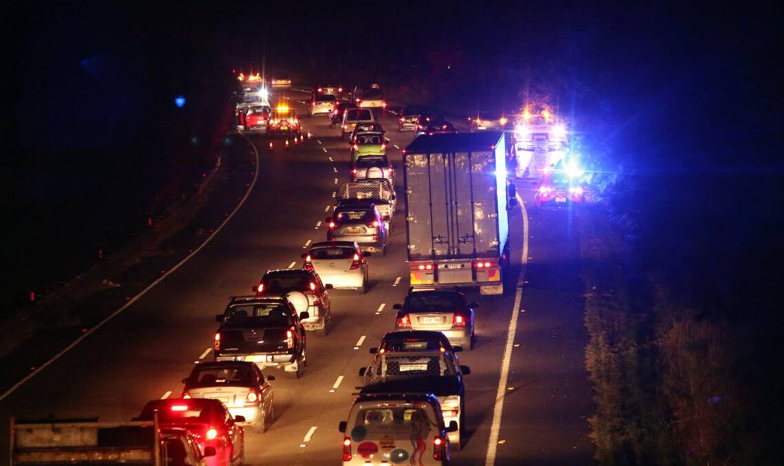 Traffic banked back along the M1 Princes Motorway at Unanderra after a crash on Wednesday night. Picture: ROBERT PEET