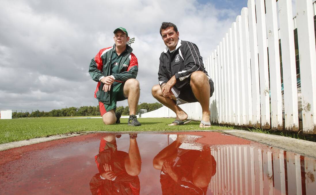 Washout: Corrimal's Xavier McDevitt (left) and Balgownie's Dean Merola were left frustrated with play called off on the second day of the final at North Dalton Park. Picture: CHRISTOPHER CHAN