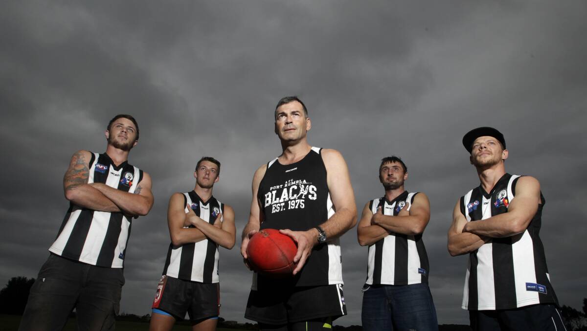 Back in Black:  New Port Kembla AFL coach Ross Combs (centre) with players (left to right) Peter Pirret, Zac Jovanovski, Stuy Baker and Robbie Worthington are looking forward to the Blacks 40th anniversary season. Picture: ANDY ZAKELI
