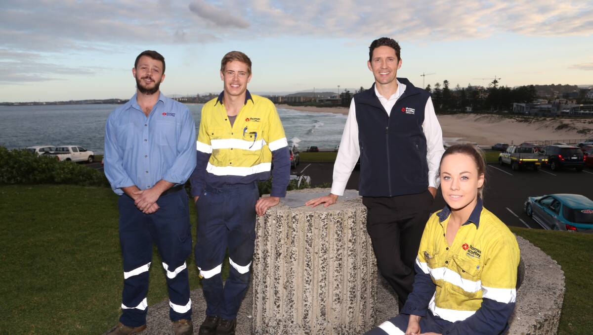 Megan Gregory (right) with Thomas & Coffey general manager Peter Buckley (second right) and workmates Chris Jansen and Brendan den Hoedt. Picture: GREG ELLIS 

