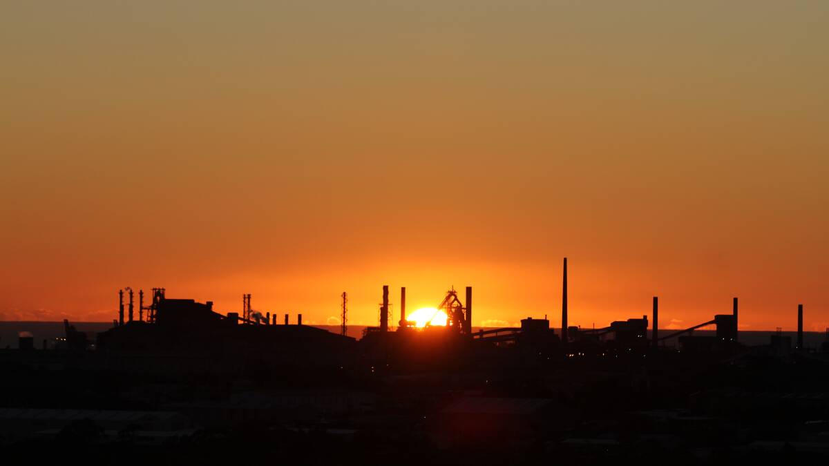 Orange sunrise over BlueScope Steel's Port Kembla steelworks. Picture by Greg Ellis.
