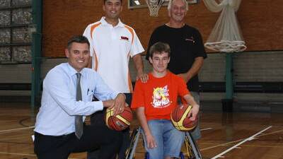 The Greater Building Society's Brendan White (front) with wheelchair athlete Nick Scott and (back) Kidzwish marketing manager Karouna Michael and Illawarra Wheelchair's Eino Okkenen at a presentation of a new wheelchair to Nick earlier this year. Picture by David Hall.
