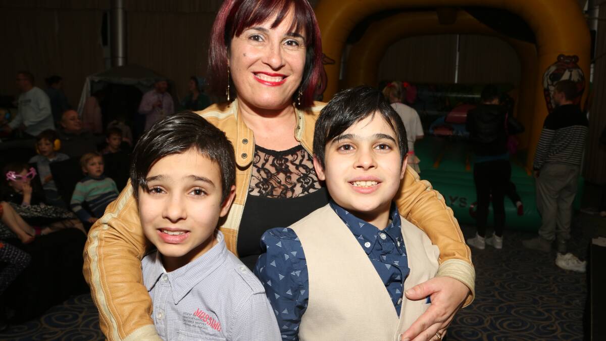 Adriana Stranges with her sons Gabriel and Michael at the Care & Share for Autism family dance party at City Beach Function Centre. Picture: GREG ELLIS
