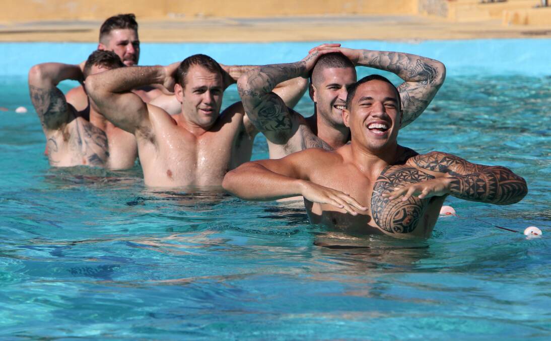 Dragons players Tyson Frizell (front) and Joel Thompson (behind on right) could be playing for a NSW jumper this weekend. Picture: KIRK GILMOUR