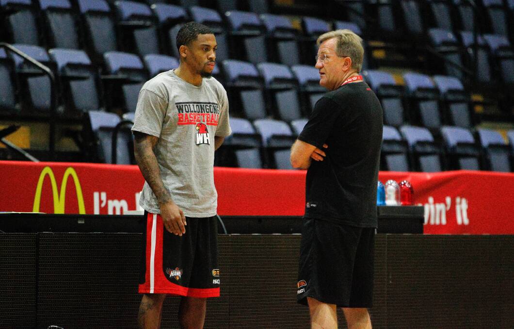 Gary Ervin and Gordie McLeod chat during training. Picture: CHRISTOPHER CHAN