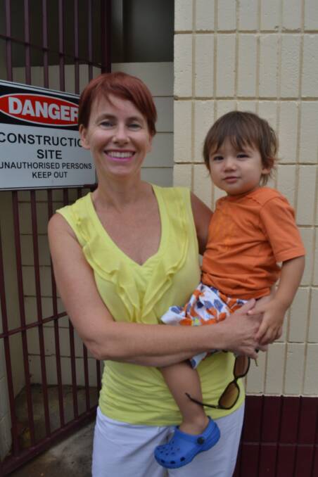 Annette Pham, with son Adam, outside the construction site that will become the Nowra Aquatic Centre. Picture: SOUTH COAST REGISTER