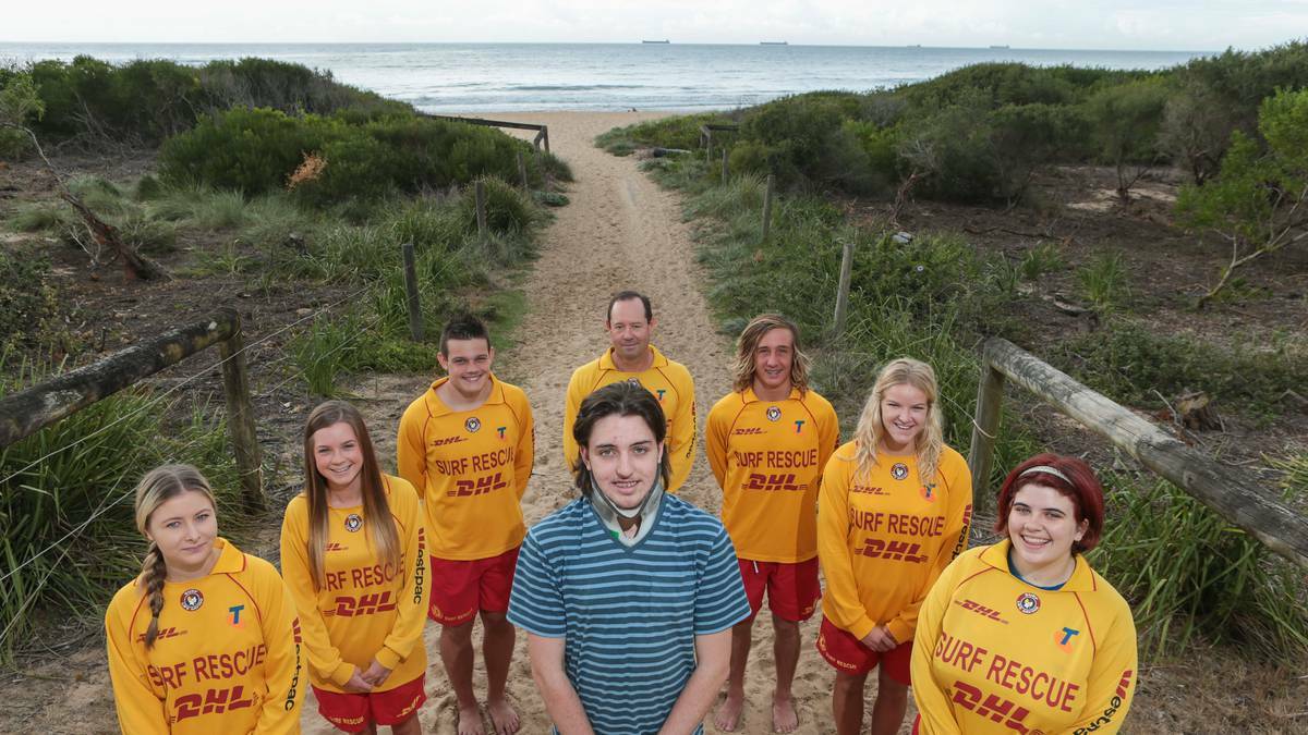 Woonona teen Lewis McLeod with the Woonona SLSC lifesavers who assisted in his rescue. Picture: ADAM McLEAN – The Illawarra Mercury